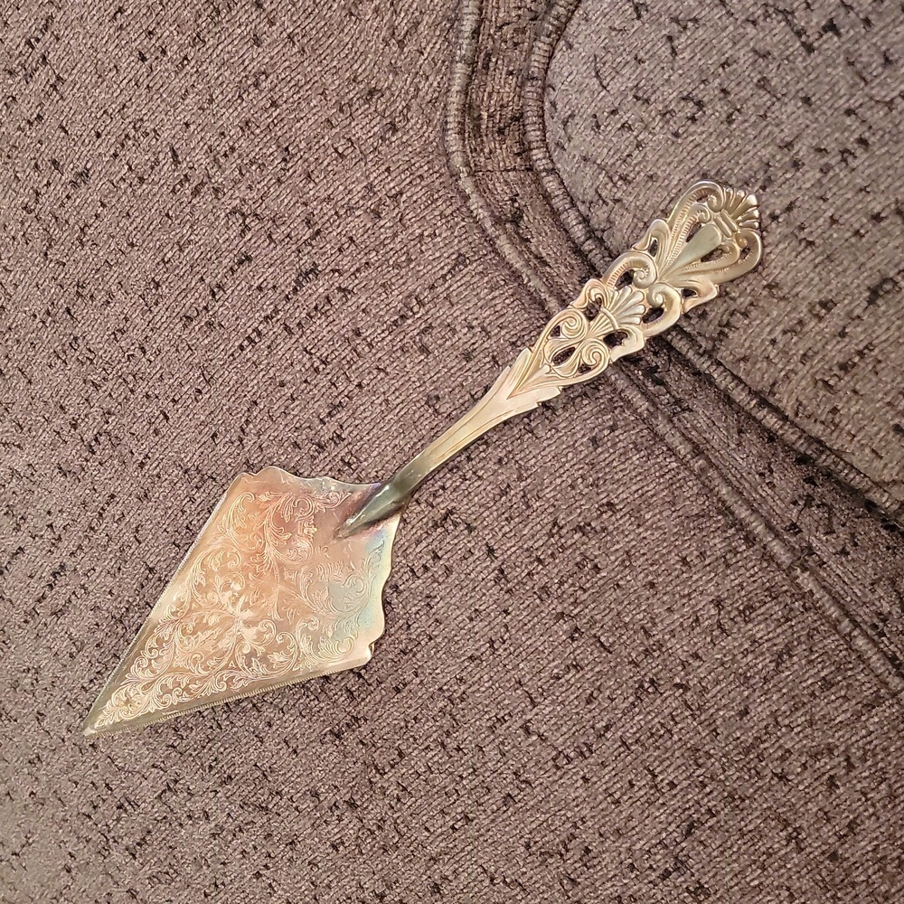 Antique silver pie cutter